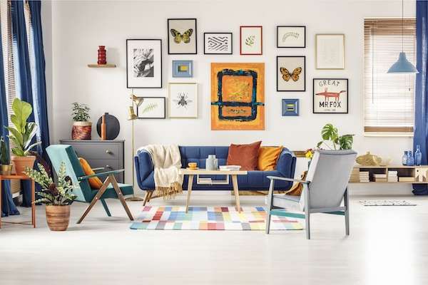 unique living room art, like posters, can be used with any color palette