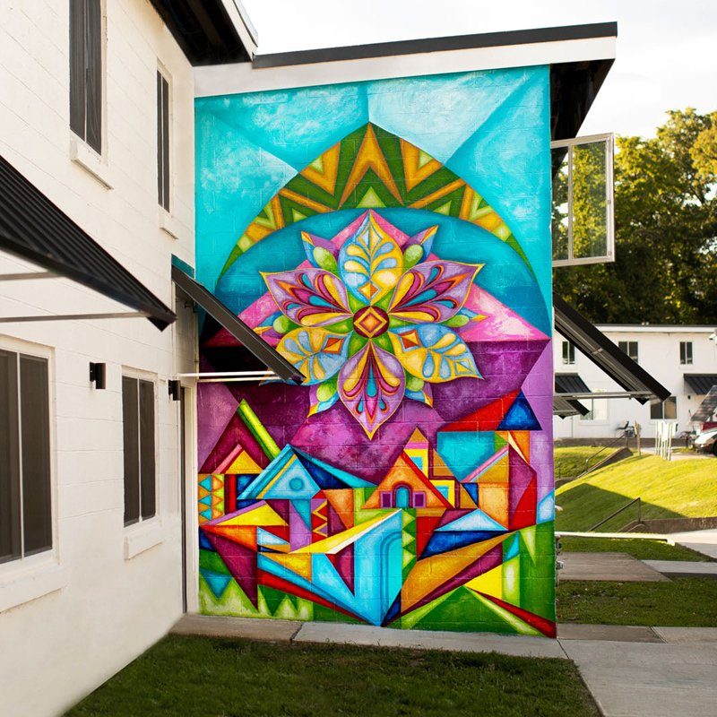 a colorful custom art mural on a building